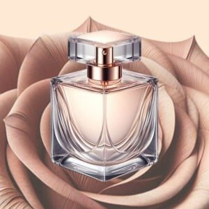 A transparent glass perfume bottle with a rose gold cap, set against a soft-focus background of large rose petals.